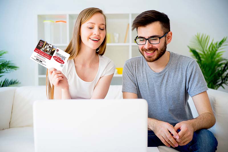 couple creating direct mail postcard